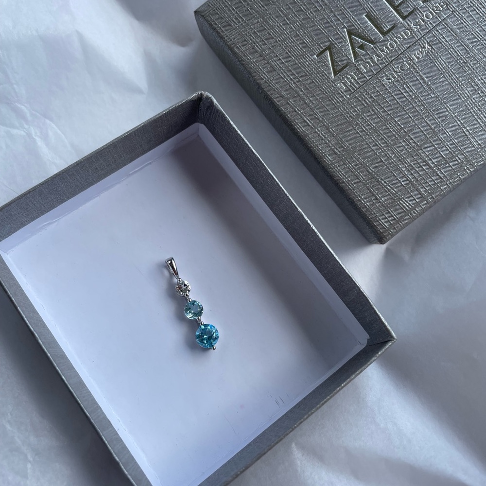Zales Blue and White Topaz Three Stone Pendant in Sterling Silver
